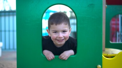 A Playful Child Joyfully Engaging in a Colorful and Vibrant Playground Full of Fun