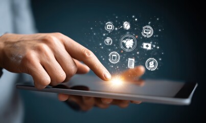 Close-up of a person's hand using a tablet; a digital interface with glowing icons is displayed in the air