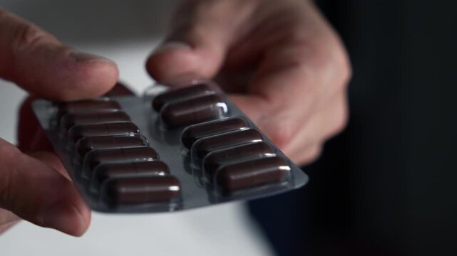 A man holds antidepressants prescribed by his doctor.
Medicines and health-improving medications.
Medicine capsules.
Vtamins in blitzer packaging.