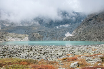Mountain lake of glacial origin Upper Akchan in late august, the Altai Republic, Russian Federation