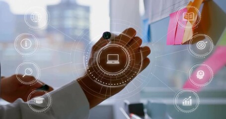 Businessman pressing pink sticky note on glass, activating laptop, analytics icons organizing ideas - Powered by Adobe