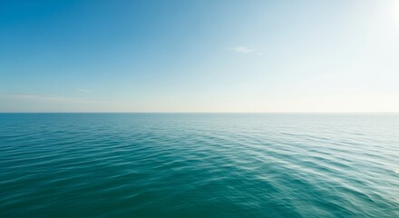 Serene expanses of aquamarine waters under a pastel azure sky evoke a sense of tranquility and vastness ideal for contemplative landscapes