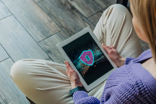 Woman with tablet with security on display, concet safe