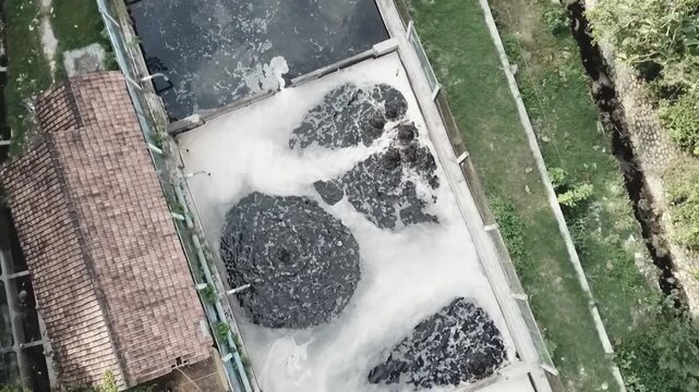 Contaminated wastewater or leachate flowing from a landfill, showing the impact of waste disposal on the environment and water pollution risks.