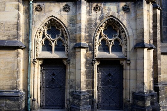 Gothic architecture with ornate arched doorways.