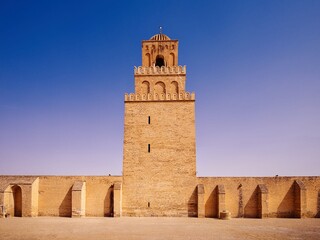 The Great Mosque of Kairouan under a clear sky.