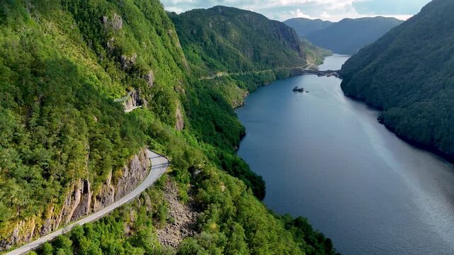 Experience the stunning beauty of Norways fjords with sweeping views of serene waters and lush green hills. The winding roads invite exploration and adventure amidst natures wonders.