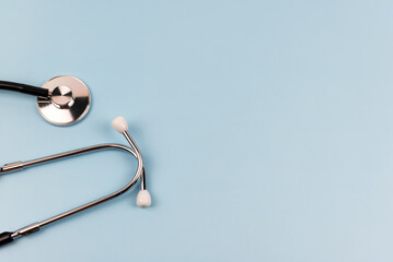 Close up of stethoscope on blue background medical concept