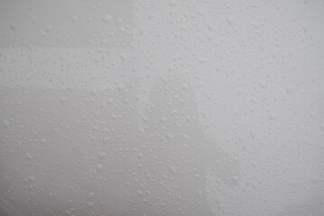 Water drops on white background. Raindrops on the window, close-up