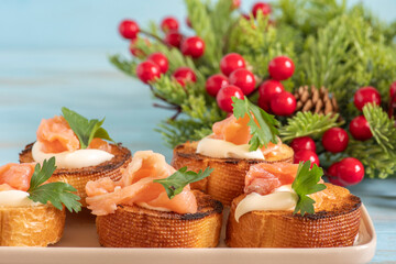 Sandwiches with smoked salmon and cream cheese for Christmas, Winter holidays.