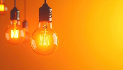 Glowing light bulbs hang against a gradient yellow background creating a warm and inviting scene with focus on illumination and clarity