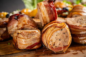 Pork medallions wrapped in bacon closeup.