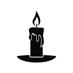 Black silhouette of a candle with dripping wax and flame
