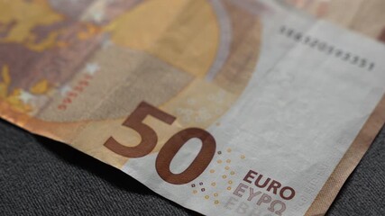 Close-up of European money.
Real euros on the table.
Accounting and economics.
The national currency of Europe and the payment of bills and goods.
Money, cash, payments, services