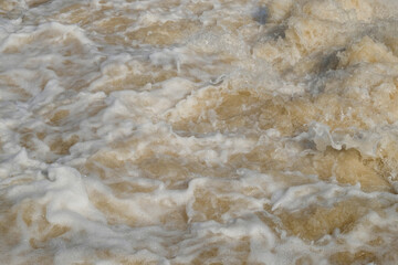 Background texture of a murky brown and foamy river flow. Ecological and environmental concept. For graphic design, 3D rendering and banner background