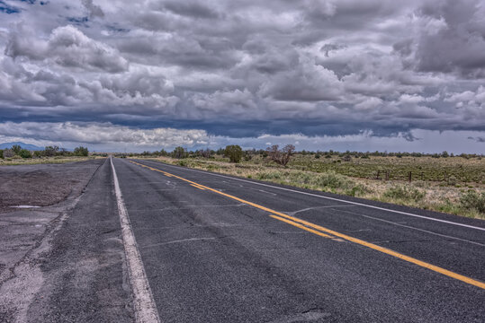 Storm clouds building over Arizona State Route 64, Arizona, USA