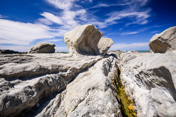 Cracked Rock Shelf Leading to Unusual Wind-Sculpted Limestone Formation at Ward Beach, Marlborough, New Zealand