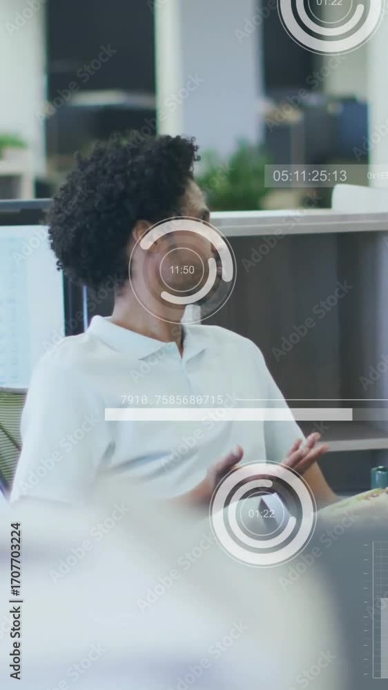 Poster animation of financial data processing over diverse colleagues discussing work in office