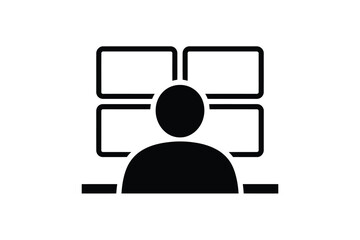 Person monitoring multiple screens in a control room setting