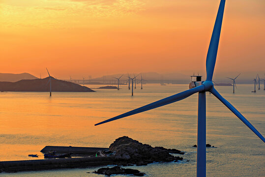 Windmills in a golden sunset, Pingtan Island, Fuzhou City, Fujian Province, China