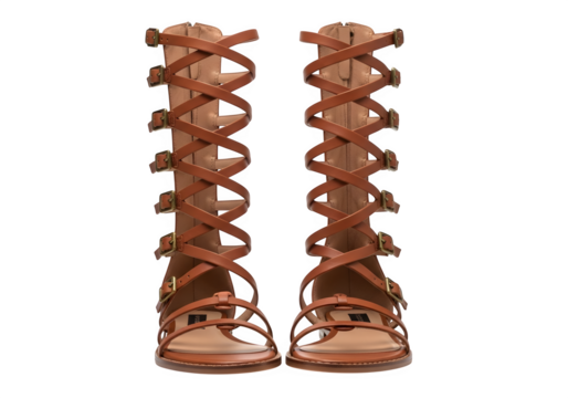 Pair of brown gladiator sandals isolated on transparent background, featuring multiple straps and buckles, evoking ancient roman style and summer fashion