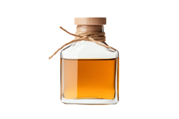 A clear glass bottle with a wooden cork and twine, filled with amber liquid against a white isolated background.