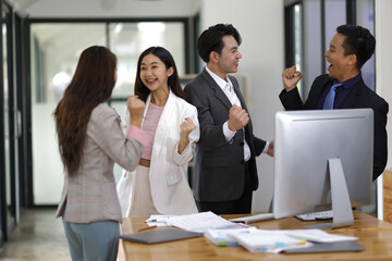 Business meeting, group of successful businessmen having fun and congratulating their colleagues in the office. Successful teamwork with coworkers.
