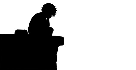 Silhouette of a Depressed Person Sitting on a ledge