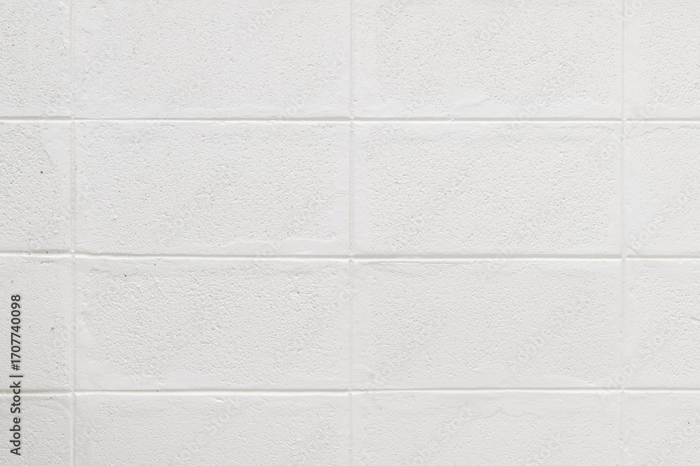 Poster clean white brick wall background showing rough texture and simple pattern of construction material.