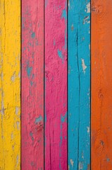 Fototapeta premium Vibrant, colorful, and weathered wooden planks create a striking visual display of hues like yellow, pink, turquoise, and orange.