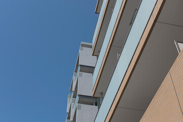 Fototapeta premium Close-up of modern apartment balconies in sunlight.