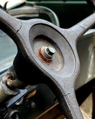 old vintage car steering wheel, with some rusted part. Concept of classical and memorial image