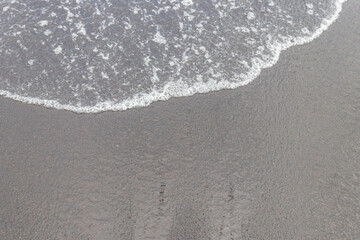 Ocean wave at black sand beach on Tenerife, Canary islands, Spain