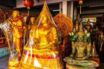 Shop selling Thai Buddha god and temple figures in Thailand.