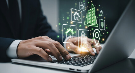 Hands on a laptop keyboard with a futuristic holographic display showing real estate and smart city icons, illustrating property technology and urban development