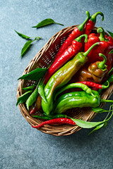 Colorful organic, homegrown  peppers in a rustic basket. Top view. Healthy homegrown vegetables