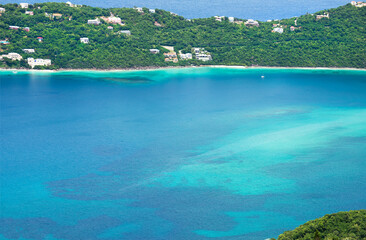 Scenic Magens Bay Beach in St. Thomas, US Virgin Islands. Clear turquoise water, lush tropical hills and white sand make it world famous Caribbean destination