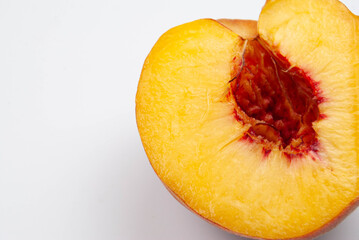 Close-up of a sliced ripe fruit on a clean background.