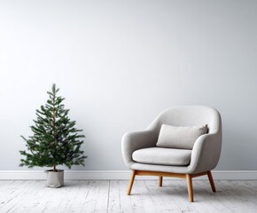 A minimalist living room scene featuring a small Christmas tree and a light gray armchair, showcasing a serene and tranquil atmosphere.