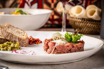 Beef tartare with quail egg and bread.