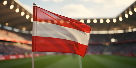 Austrian flag waving proudly in a stadium setting, representing national pride and sports spirit during competition
