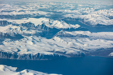 Obraz premium Aerial view of glacial fjords and snowy peaks on Baffin Island