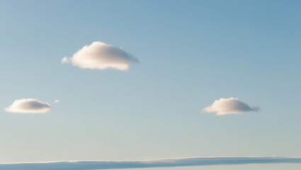 Daytime sky, clear blue gradient, few soft fluffy white clouds, minimalist clean background, calming and simple