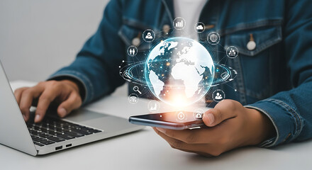 Person using laptop and phone with digital globe and icons overlay representing global connectivity ai generated