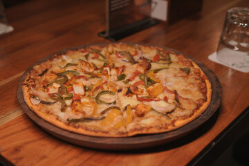 Freshly Baked Vegetable Pizza on Wooden Table