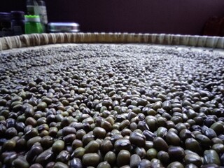 Obraz premium close up of black cereal on winnowing tray