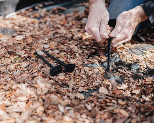 Mulching garden soil with agrotextile and large bark to control weeds