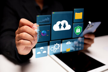 A person interacts with a digital interface displaying various data and security icons, symbolizing technology and data management.