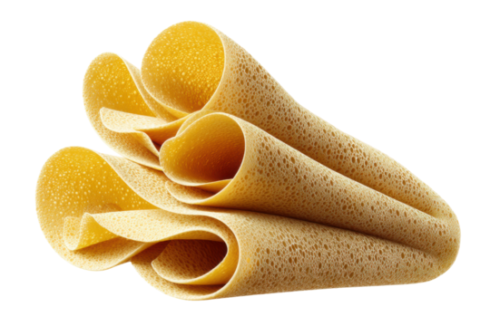 Close-up of rolled golden injera bread with bubble texture on black background, cut out