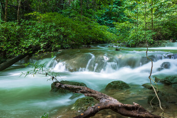 Crystal clear jungle stream with flowing water at Huay Mae Khamin National Park, Kanchanaburi, Thailand